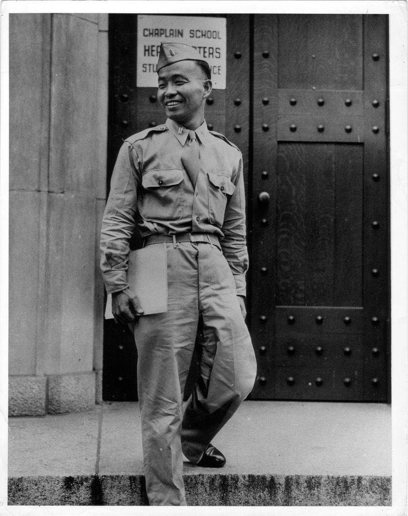 Hiro Higuchi, an army chaplain in the 442nd Regimental Combat Team, standing outside chaplain school headquarters in uniform.