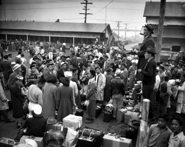 Japanese Americans from Seattle arriving at Puyallup detention facility.