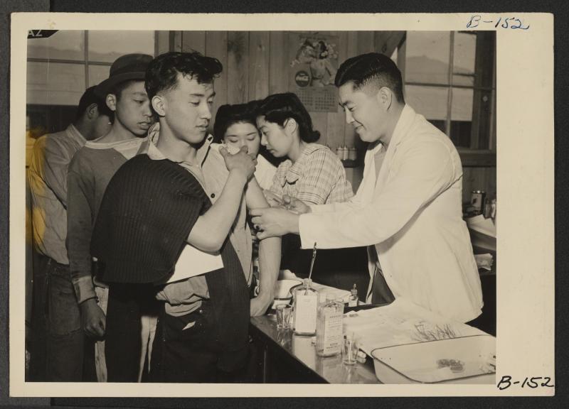 Japanese Americans receiving typhoid inoculations in Manzanar concentration camp.