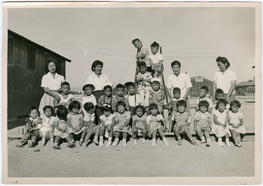 Photo of Japanese American children and caretakers at the nursery school in Topaz concentration camp.