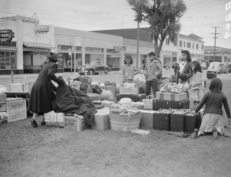 Salinas, California, March 31, 1942: Baggage is being assembled to be taken by truck to the Salinas Assembly center where evacuees from this area awaited transfer to a War Relocation Authority center. Courtesy of the National Archives and Records Administration