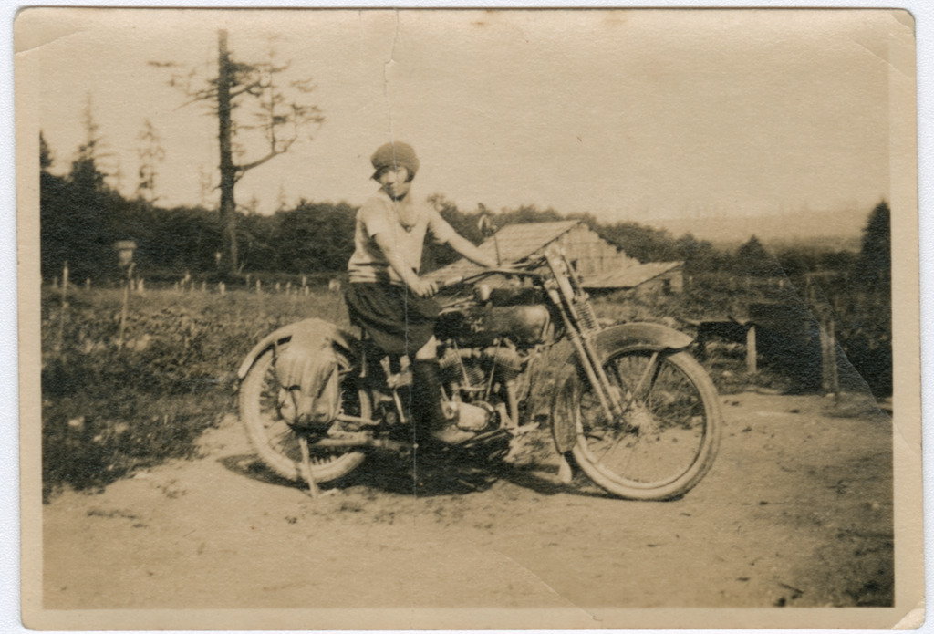 A young Japanese American woman on a motorcycle in the 1920s.