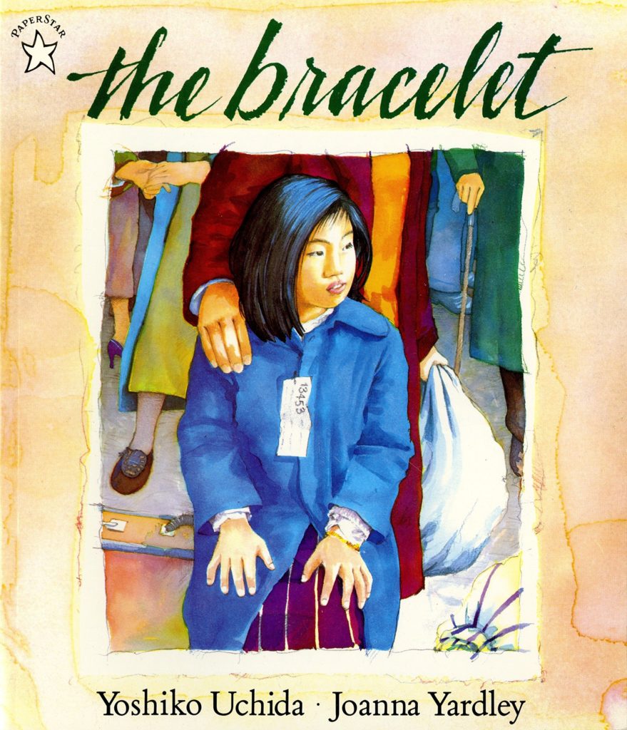 Book cover for The Bracelet by Yoshiko Uchida. Features illustration of a young Japanese American girl wearing an evacuation tag.