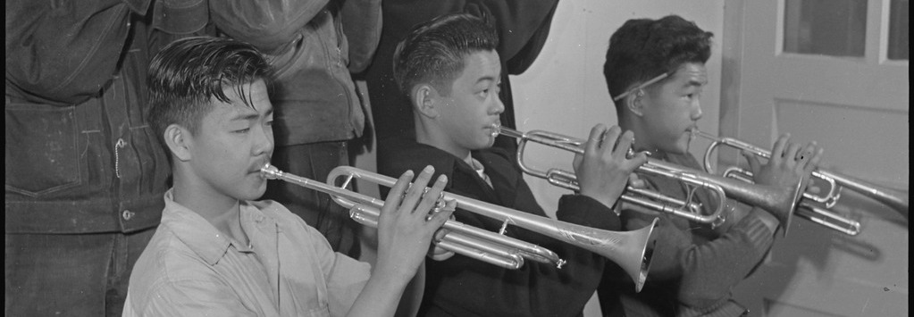 Japanese American high school students playing in a brass band in Rohwer concentration camp.