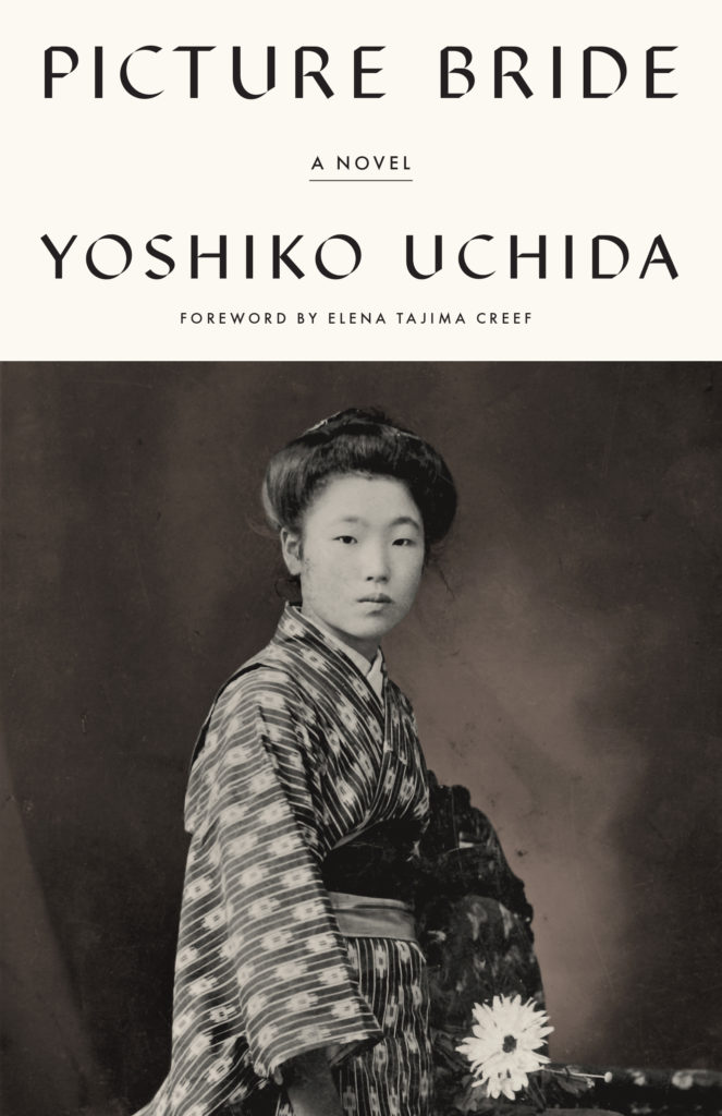 Book cover of the 2022 re-release of Picture Bride by Yoshiko Uchida. The images features a black and white photo of a young woman wearing a kimono.