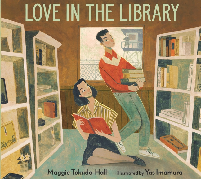 Cover art for Love in the Library, written by Maggie Tokuda-Hall and illustrated by Yas Imamura. The artwork shows Tama and George together in a small library, with a guard tower and barbed wire fence visible through a window behind them.