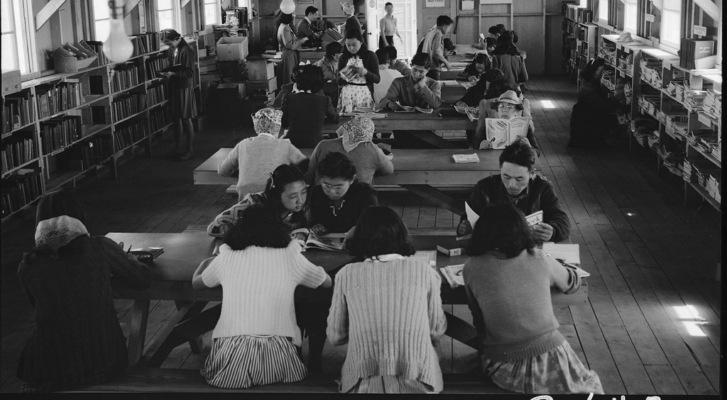 Japanese Americans reading in the library at Tanforan Assembly Center.