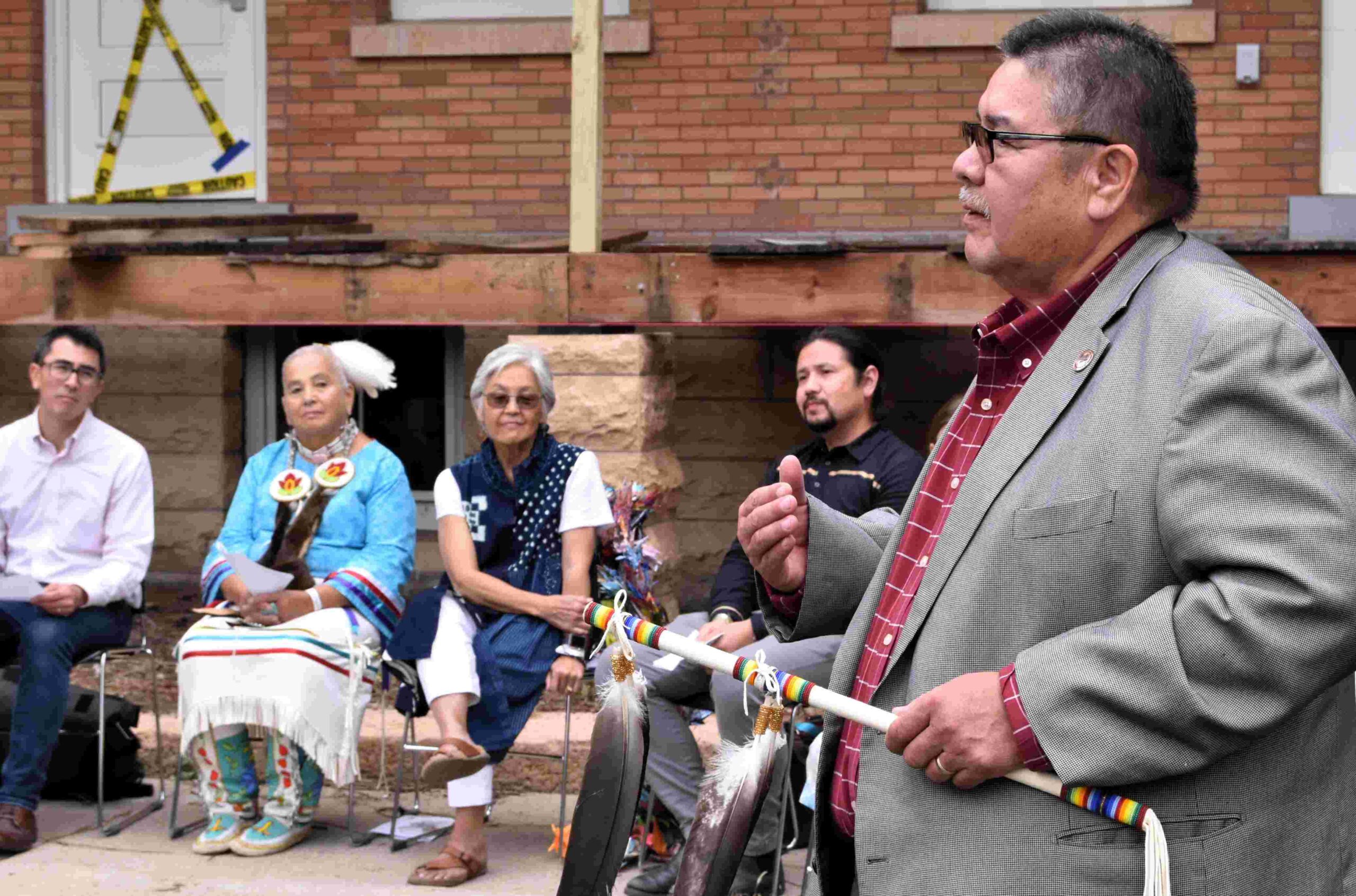 With talking stick in hand, UTTC President Leander R. McDonald presides over the ground blessing ceremony for the Snow Country Prison Japanese Internment Memorial.