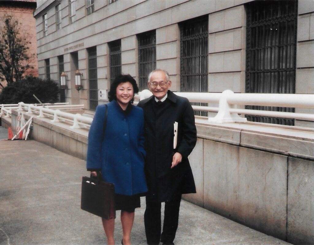 Minoru Yasui and his lead attorney Peggy Nagae outside a courthouse.