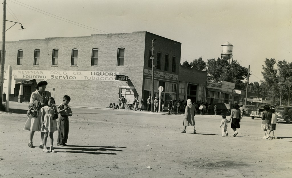 Japanese Americans walking down the street in Granada, Colorado, a small town near the Amache concentration camp.