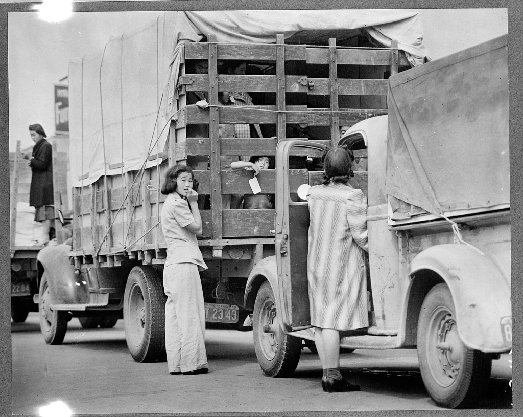 Japanese Americans preparing to leave Redondo Beach in a car caravan to Manzanar.