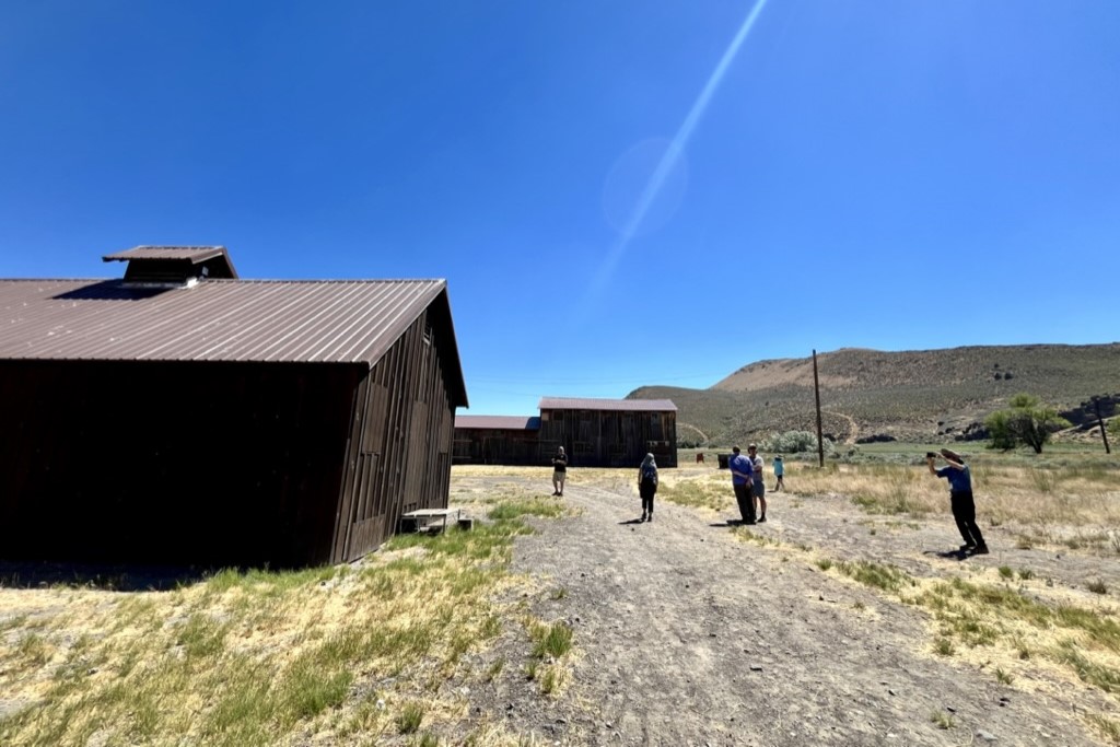 Pilgrimage attendees explore barracks on the site of the Tule Lake concentration camp.