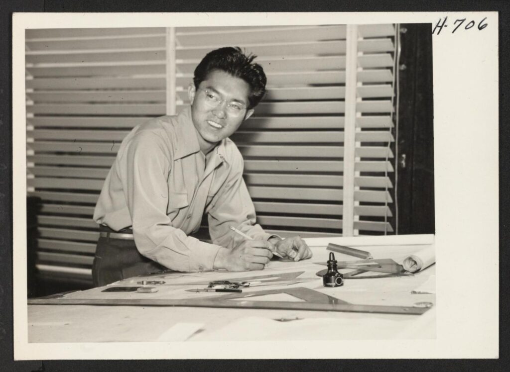 Iwao Takamoto working on illustrations in the Walt Disney Studio in 1945.