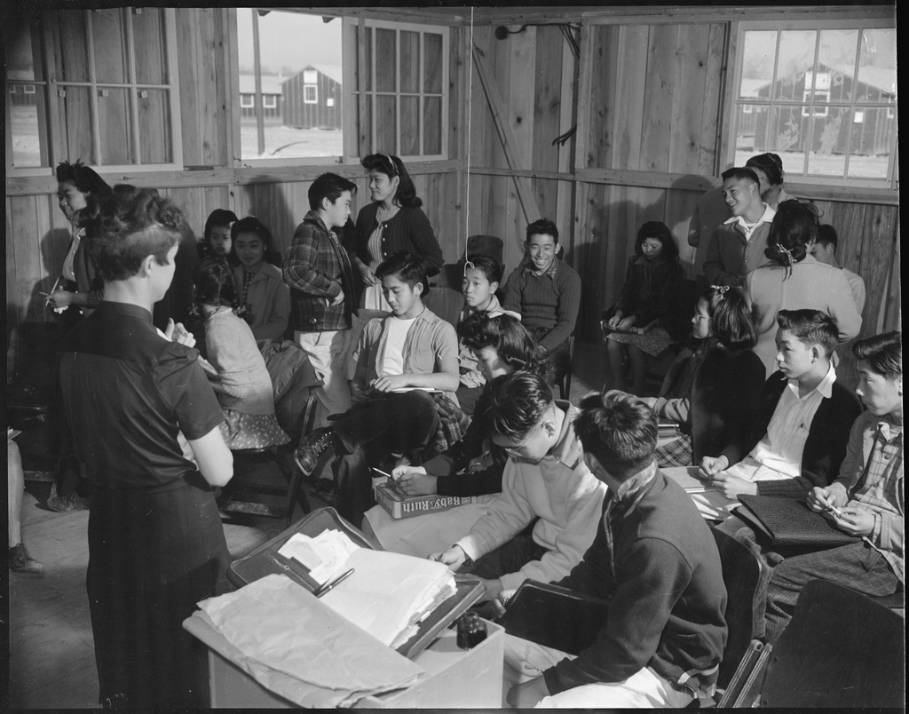 Ninth grade students and their teacher in a classroom in Rohwer concentration camp.