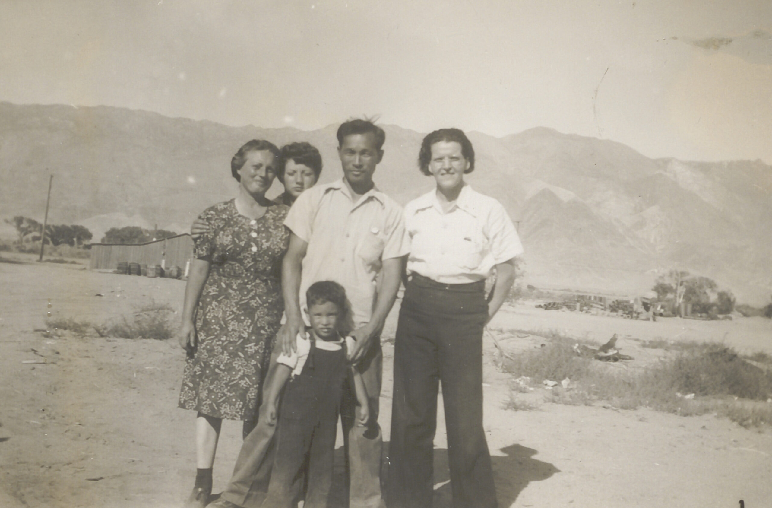 Elaine, Karl, and Tommy as Luella "Happy" Brannan and Joyce Russell, Elaine’s daughter, visit the Yonedas at Manzanar in June 1942.