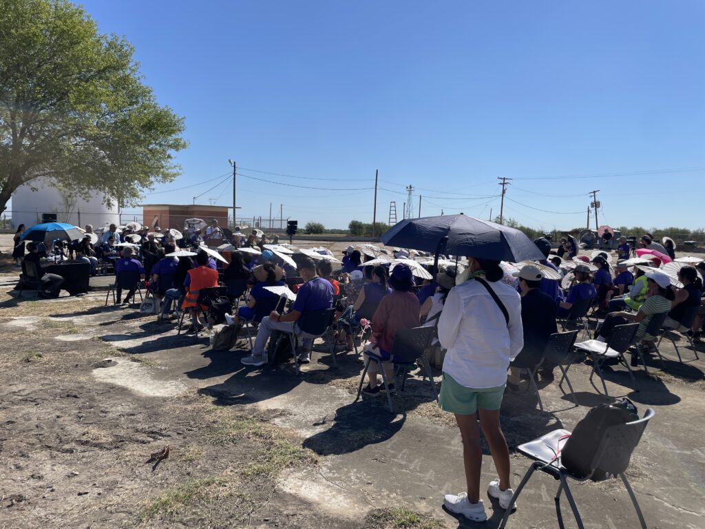 Crowd sitting during the morning ceremony in Crystal City. 
