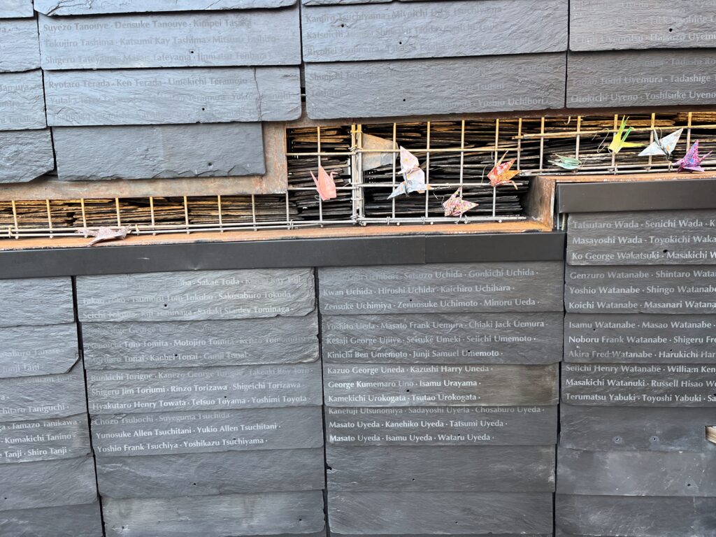 The Snow County Prison Memorial Wall which is engraved with former incarcerees' names, and also has paper cranes embedded into the design.