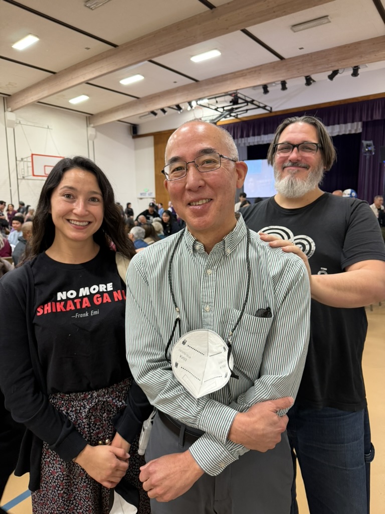 Densho staff Jennifer Noji, Brian Niiya, and Geoff Jost at the Los Angeles Day of Remembrance event. February 21, 2026.