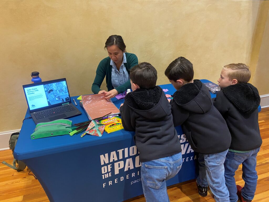 Courtney Wai tabling at the National Museum of the Pacific War Day of Remembrance event. February 21, 2026, Fredericksburg, Texas.