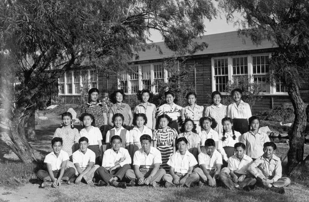 Class photo of students in front of a school building at Crystal City internment camp